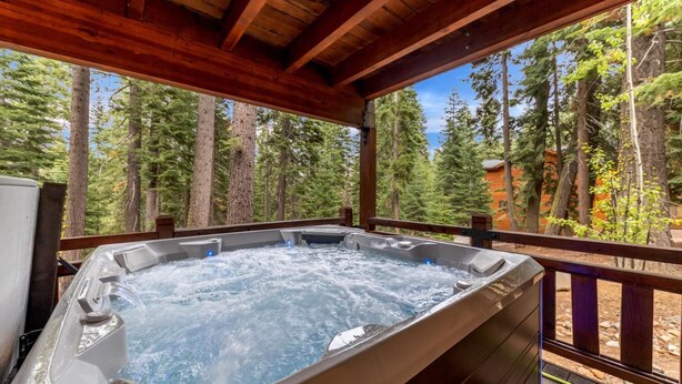 A hot tub in a wooden deck with a forest view. - Blue Moose -2 Masters, Hot Tub + Generator (Truckee)