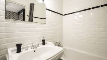 Bathtub, hair dryer, towels, soap