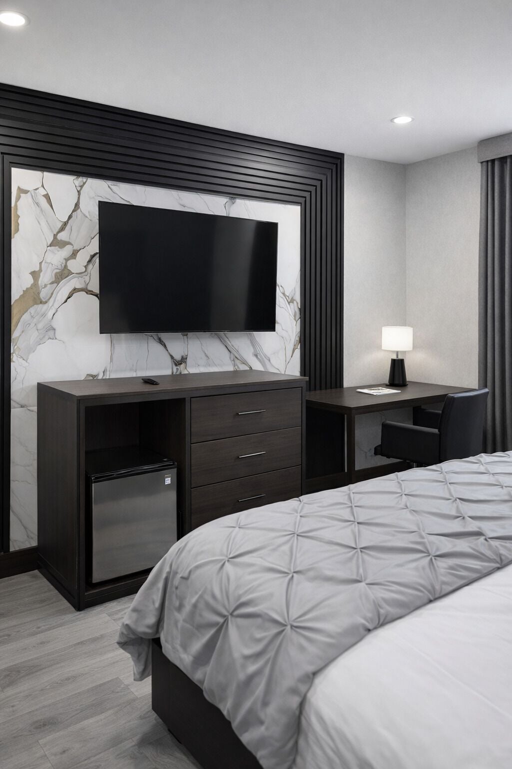 Desk, iron/ironing board, bed sheets