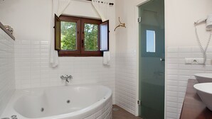 Bathtub, jetted tub, hair dryer, towels