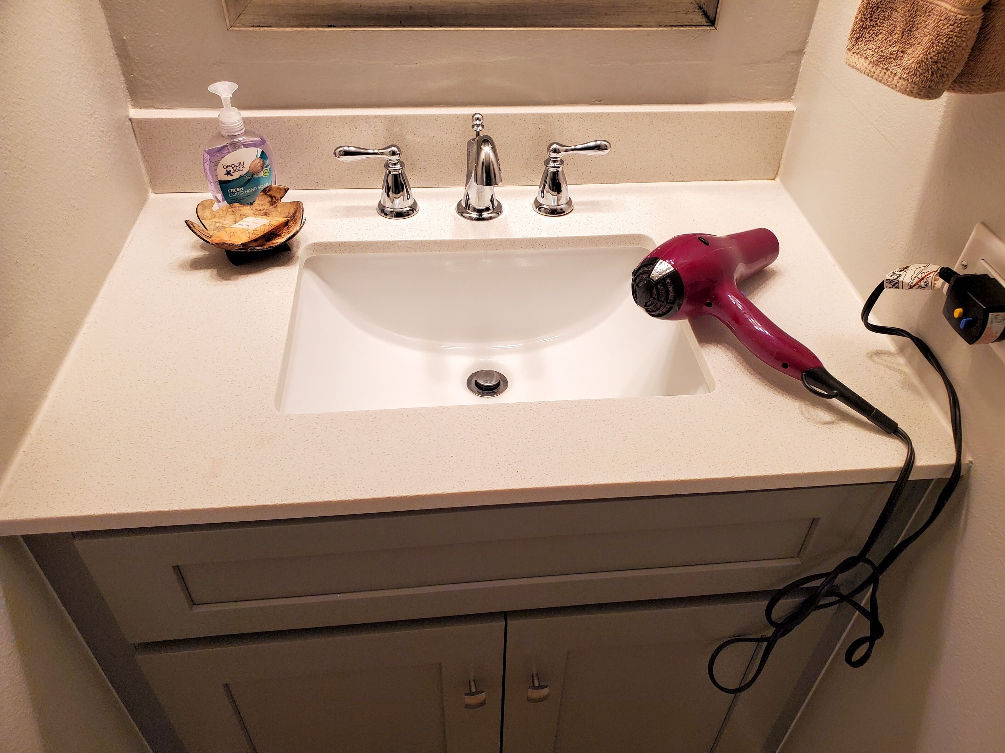 Combined shower/tub, hair dryer, towels, soap