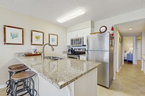 Fridge, microwave, oven, stovetop - Gulf front condo with community outdoor and indoor pools, hot tub, and sauna (Gulf Shores)