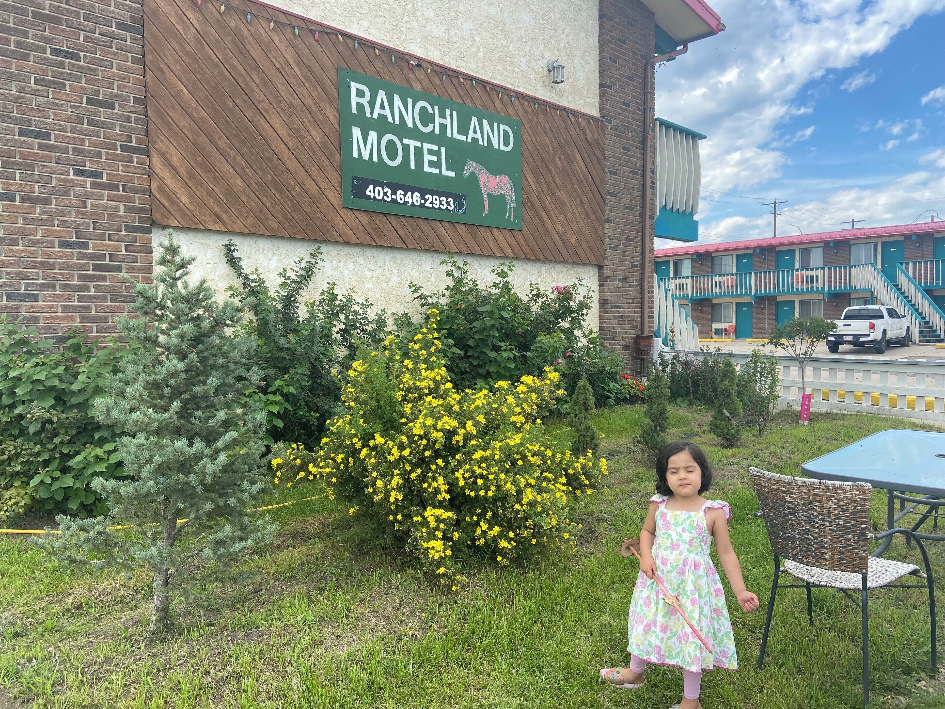 A motel named RANCHLAND with a contact number 403-646-2933.