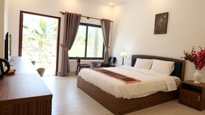 Deluxe Room, Resort View | Minibar, desk, laptop workspace, blackout drapes - Anna Beach Resort (Phan Thiet)