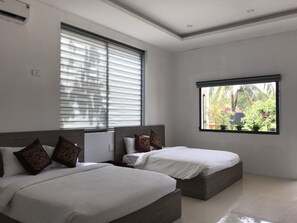 Deluxe Quadruple Room, 2 Queen Beds | Minibar, desk, laptop workspace, blackout curtains - Anna Beach Resort (Phan Thiet)