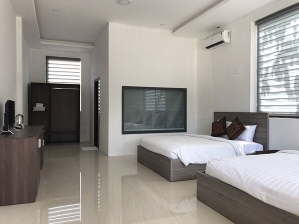 Deluxe Quadruple Room, 2 Queen Beds | Minibar, desk, laptop workspace, blackout drapes - Anna Beach Resort (Phan Thiet)