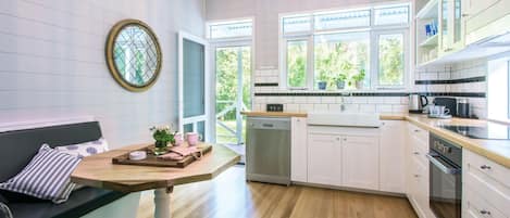 Microwave, stovetop, dishwasher, dining tables