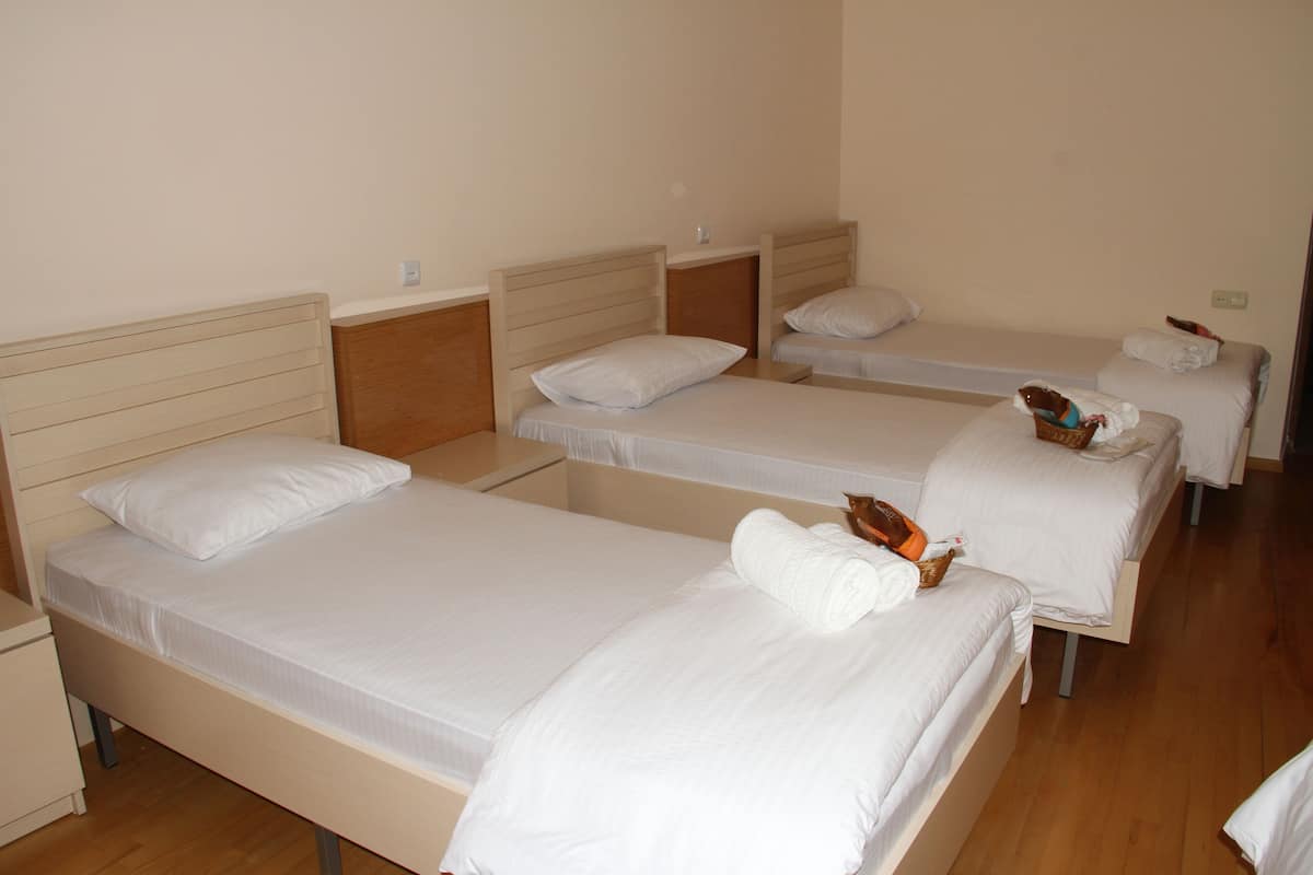Standard Quadruple Room | Premium bedding, soundproofing, iron/ironing board, free WiFi