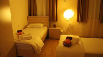 Standard Quadruple Room | Premium bedding, soundproofing, iron/ironing board, free WiFi