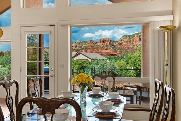 Enjoy meals with a view of the surrounding mountains and red rock formations from this dining area.