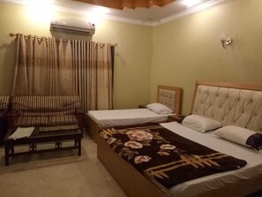 Family Room | 10 bedrooms, blackout curtains, soundproofing, iron/ironing board - Pearl Inn Gulshan (Karachi)