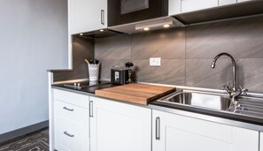 Fridge, microwave, stovetop, coffee/tea maker