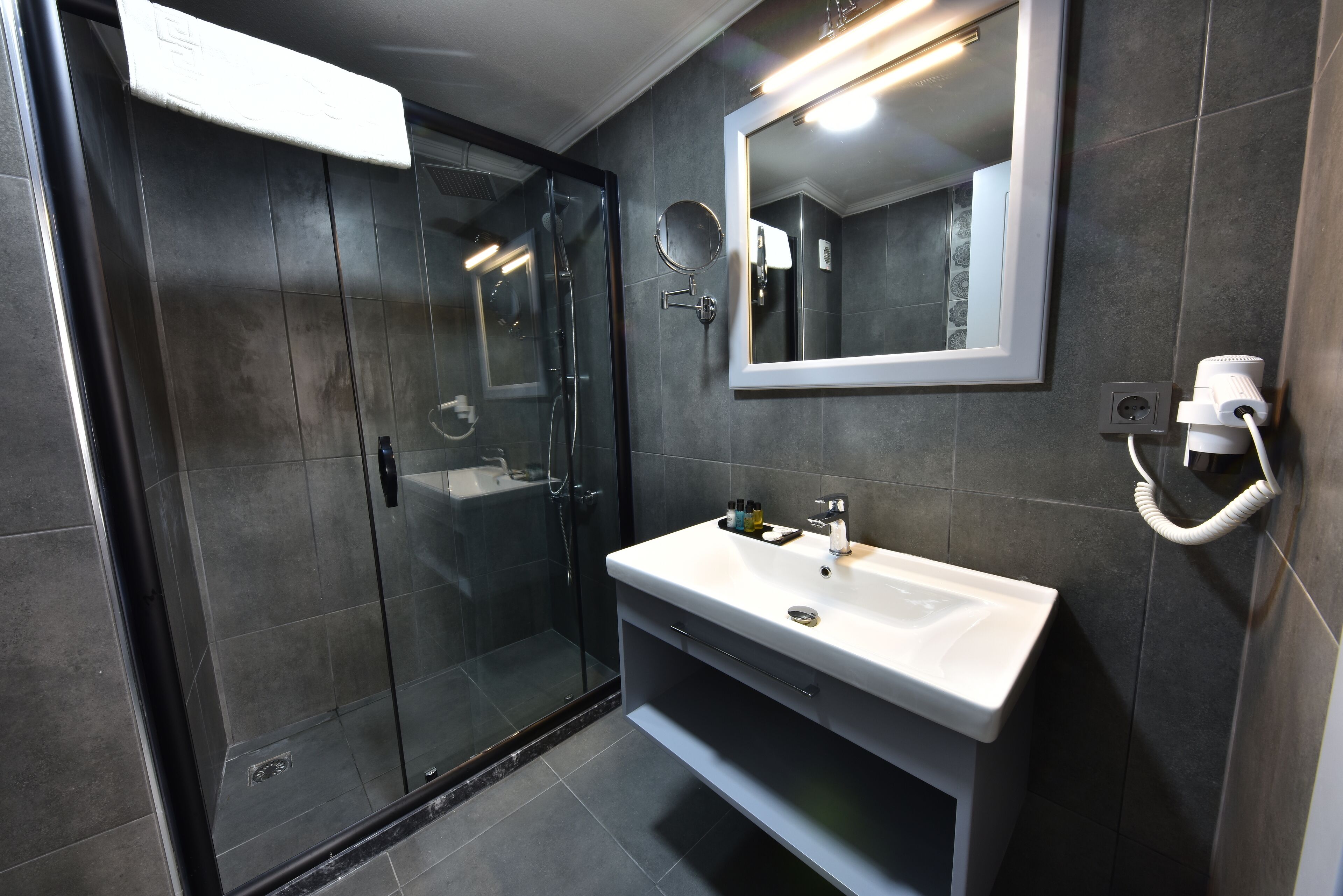 standard double or twin room | bathroom | shower, rainfall showerhead, eco-friendly toiletries, hair dryer