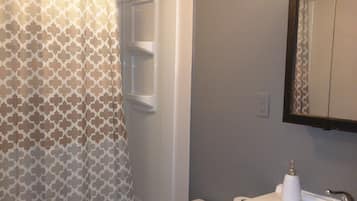 Combined shower/tub, hair dryer, towels, soap
