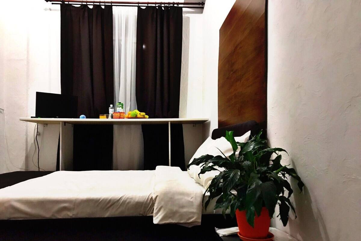 Hypo-allergenic bedding, down duvets, desk, laptop workspace