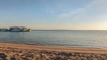 Beach nearby, beach umbrellas, beach towels, beach bar