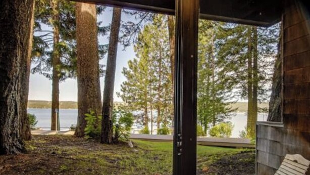 A cabin with a view of a lake and tall trees. - *BBQ*Private Beach*W/D*Self Check-In (McCall)