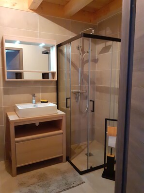 Shower, hair dryer, towels, toilet paper