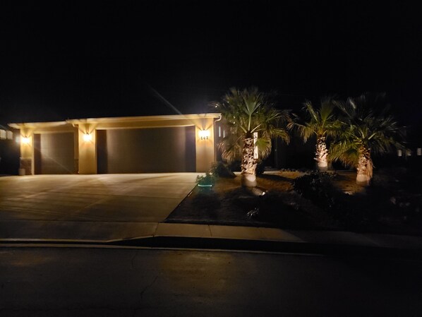 Guests can park their vehicles in the covered area, with easy access to the well-lit garage entrance.