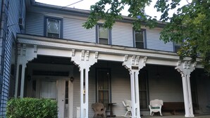 A two-story house with a porch featuring white columns and a number '601' sign. - Historic Victorian - 1 Hour N of Nashville (Russellville)