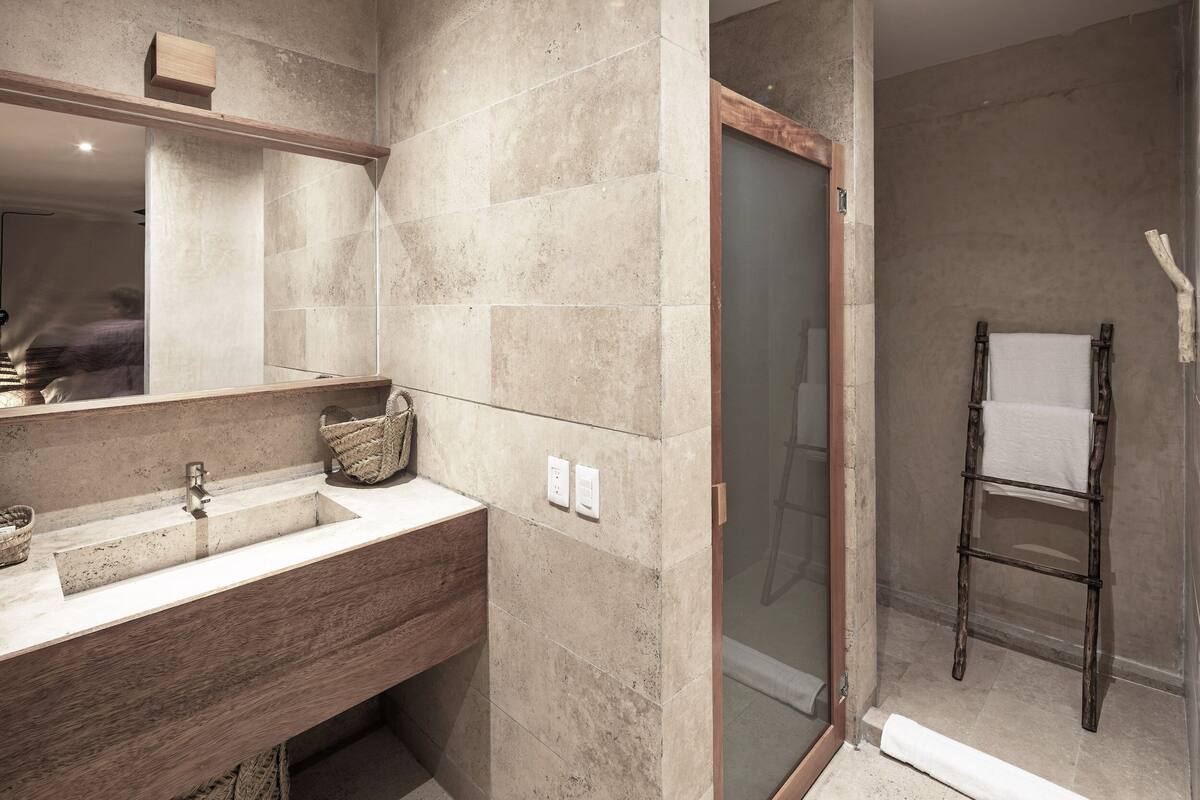 shower, designer toiletries, hair dryer, slippers