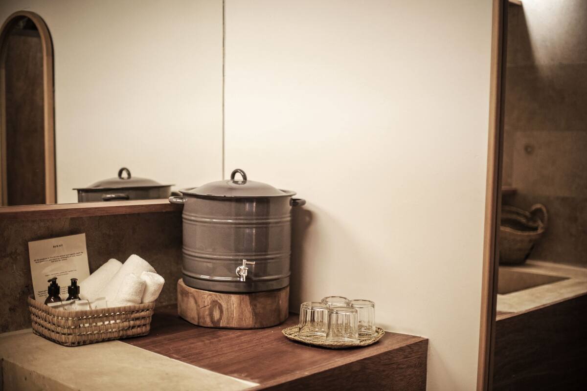 luxury tree house, pool view, mezzanine | bathroom | shower, designer toiletries, hair dryer, slippers