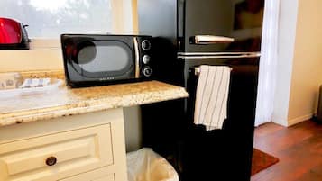 Microwave, coffee/tea maker, toaster, cookware/dishes/utensils