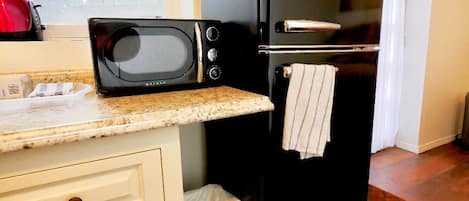 Microwave, coffee/tea maker, toaster, cookware/dishes/utensils