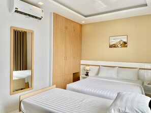 Deluxe Triple Room, Balcony | Minibar, desk, iron/ironing board, free WiFi - Maya Hotel (Ho Chi Minh City)