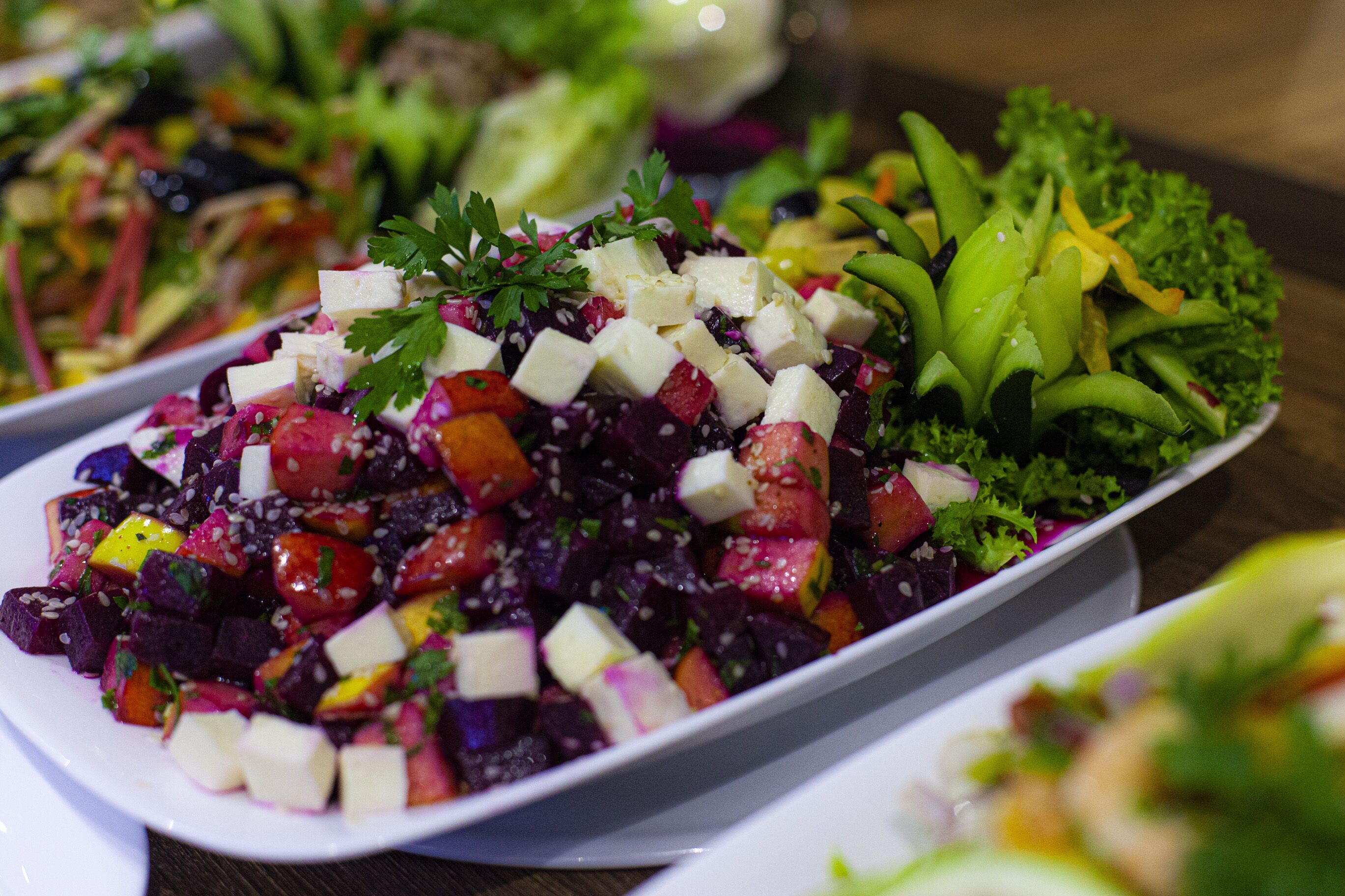 A variety of colorful salads on a table.