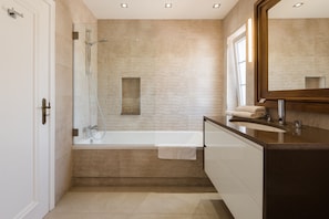 Bathtub, hair dryer, towels