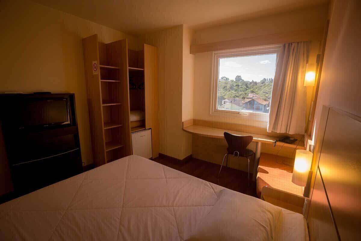 minibar, desk, laptop workspace, blackout curtains