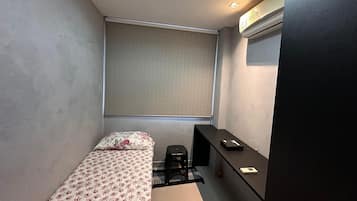 Premium bedding, desk, laptop workspace, soundproofing