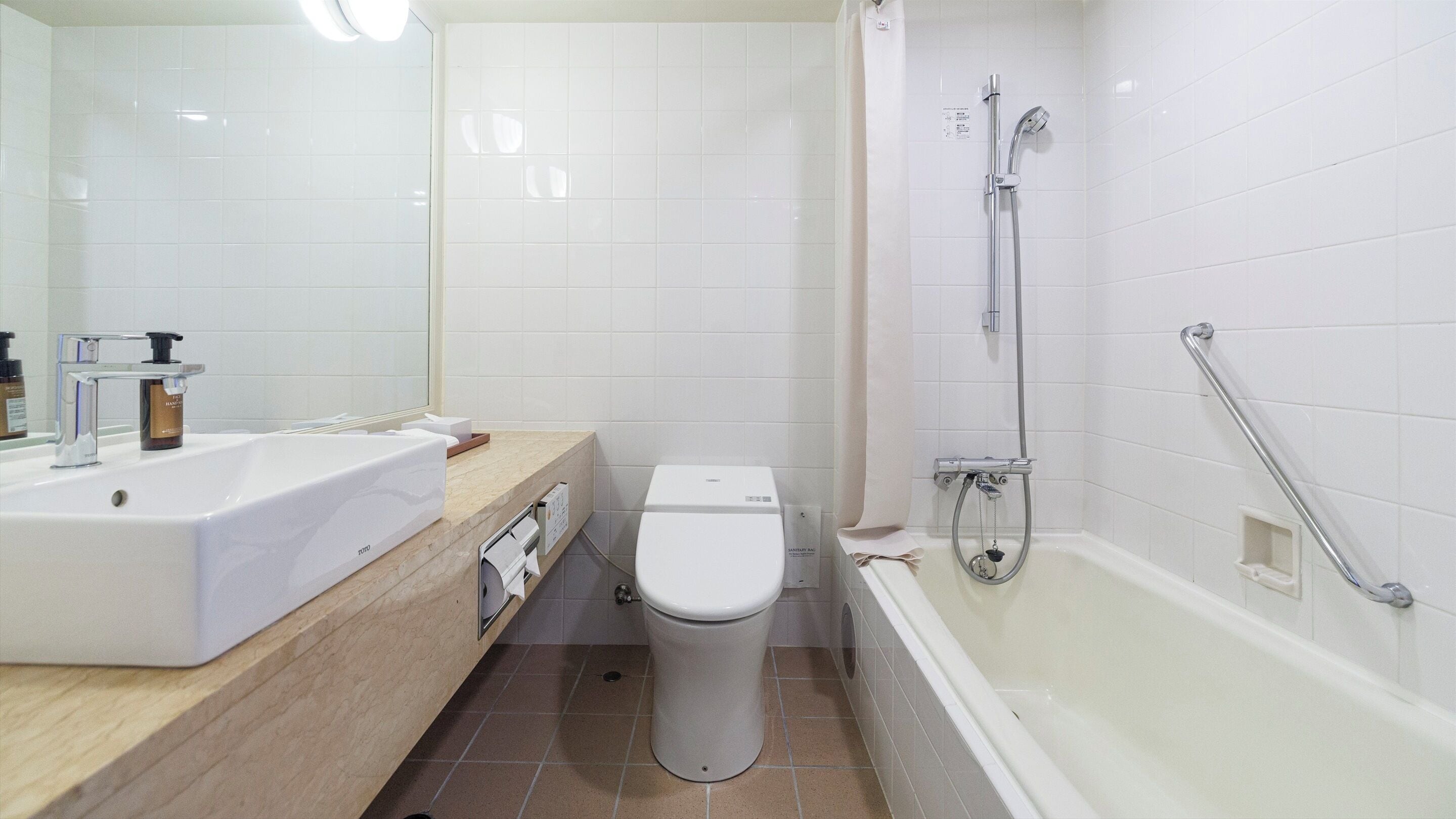 combined shower/bathtub, free toiletries, hair dryer, slippers