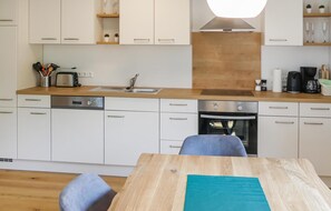 Fridge, stovetop, dishwasher, coffee/tea maker