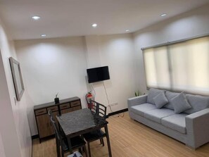 2 BR Apartment Deluxe | Living room | Flat-screen TV - Tatay Seseng's Apartment  Panglao (Panglao)