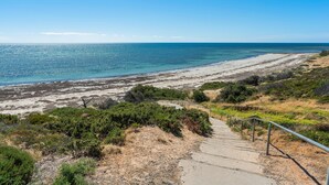 A coastal path leading to a beach with clear skies. - Sea Star - Aldinga Beach - C21 SouthCoast Holidays (Aldinga Beach)
