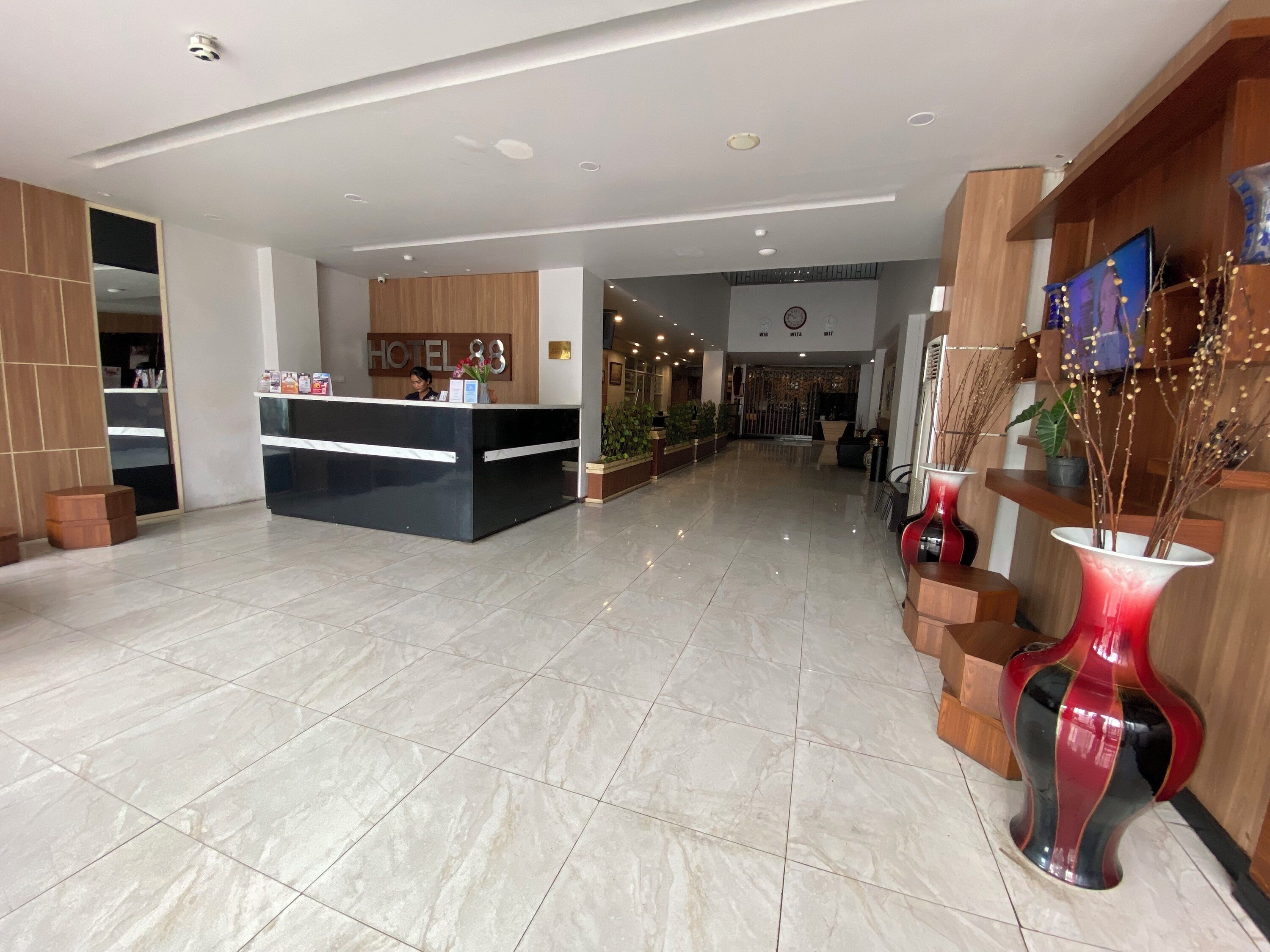 A hotel reception area with a reception desk, a wooden reception desk, a reception counter, a reception area, a reception desk, a reception counter, a reception area, a reception desk, a reception counter, a reception area, a reception desk, a reception counter, a reception area, a reception desk, a reception counter, a reception area, a reception desk, a reception counter, a reception area, a reception desk, a reception counter, a reception area, a reception desk, a reception counter, a reception area, a reception desk, a reception counter, a reception area, a reception desk, a reception counter, a reception area, a reception desk, a reception counter, a reception area, a reception desk, a reception counter, a reception area, a reception desk, a reception counter, a reception area, a reception desk, a reception counter, a reception area, a reception desk, a reception counter, a reception area, a reception desk, a reception counter