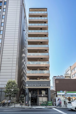 A multi-story hotel with a modern facade, large windows, and a prominent entrance.