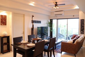 Deluxe Apartment, Ocean View (Lower Floor) | Living area | Flat-screen TV - Ocean Front Yamakawa (Motobu)