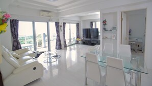 Superior Apartment, Ocean View | Living area | Flat-screen TV - Ocean Front Yamakawa (Motobu)