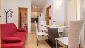 Apartment, 1 Bedroom (A2) | Living area | Flat-screen TV