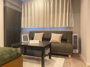 Estudio Deluxe, varias camas, no fumadores, frigorífico y microondas (Family) | Zona de estar