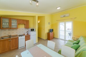 Apartment, Sea View (A2) | Private kitchen | Fridge, microwave, stovetop, coffee/tea maker