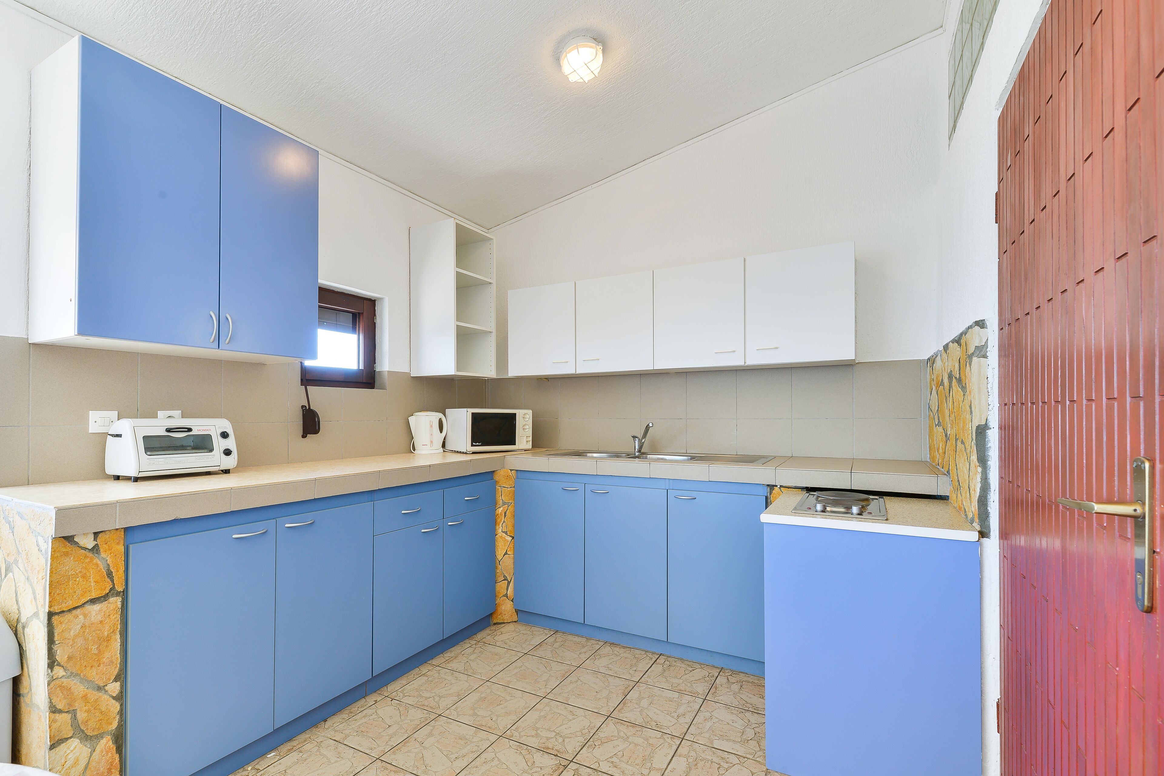 Apartamento, 4 quartos (A4) | Cozinha privada | Geladeira, micro-ondas, cooktop, cafeteira/chaleira