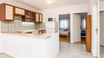 Apartment, 2 Bedrooms A1 | Private kitchen | Fridge, microwave, oven, stovetop