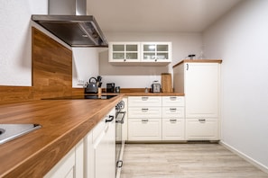 Apartamento executivo | Cozinha privada | Geladeira grande, fogão, cooktop, lava-louças