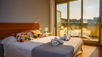 Apartment, 2 Bedrooms, Sea View | 2 bedrooms, blackout curtains, iron/ironing board, travel cot