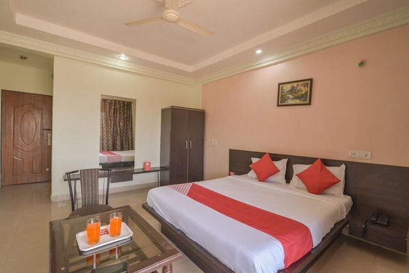 Standard Double Room | Living area | 32-inch LED TV with cable channels, TV