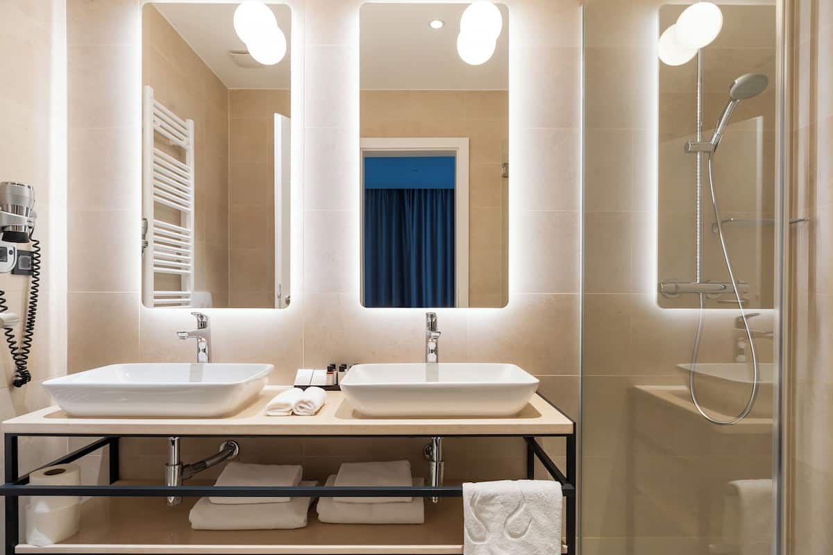 superior room, 1 king bed | bathroom | shower, free toiletries, hair dryer, slippers